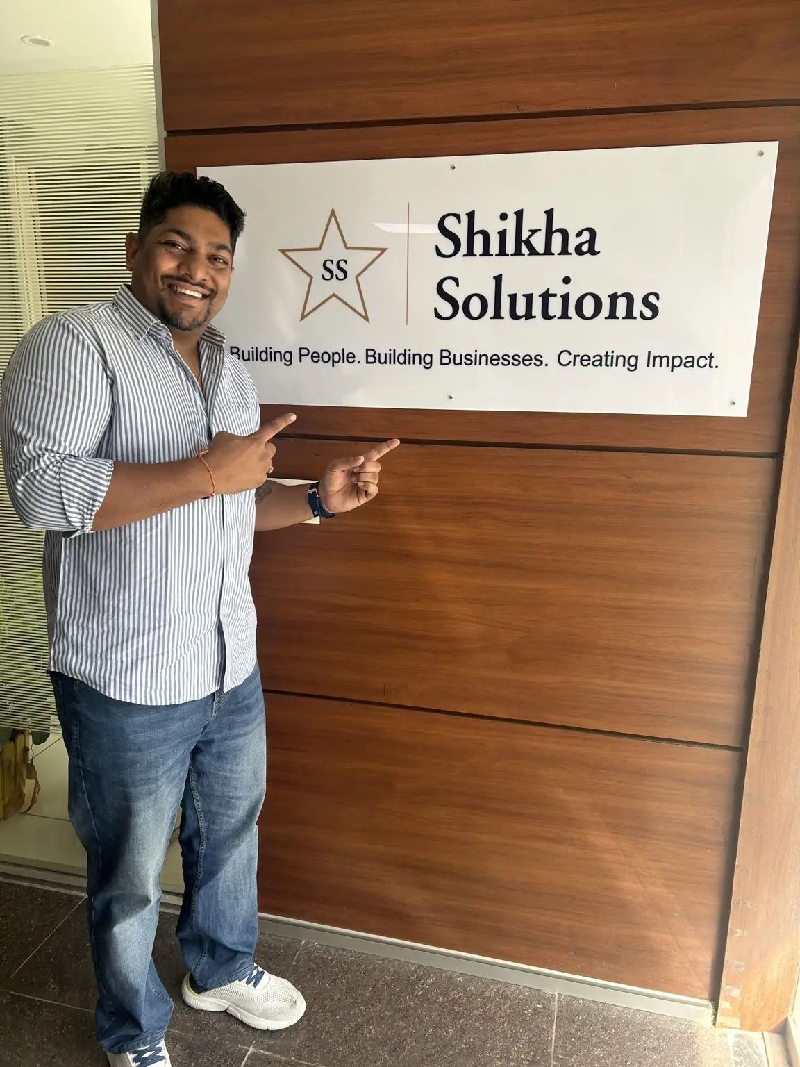 Aanant Goyal smiling at the Shikha Solutions office